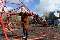Councillor Mark Deaville taking a closer look at the new play area at Brough Park ahead of it opening